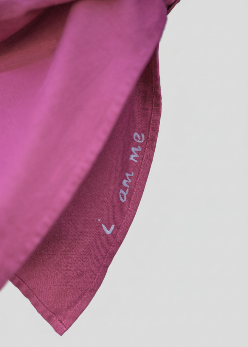 SHOWING THE PLEAT DETAIL OF A HOUSE OF MALIBU KIMONO SLEEVE AND THE HAND-PAINTING AFFIRMATION "I AM ME