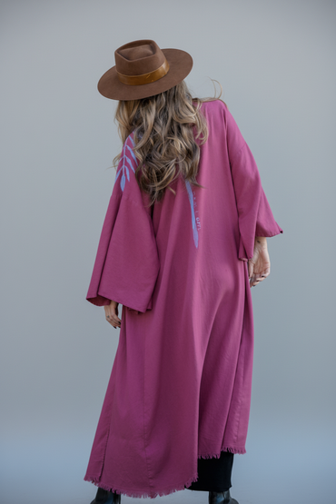 Woman wearing an ankle length raspberry kimono with periwinkle blue habd-painted spine stripe and quote "take me as i am"