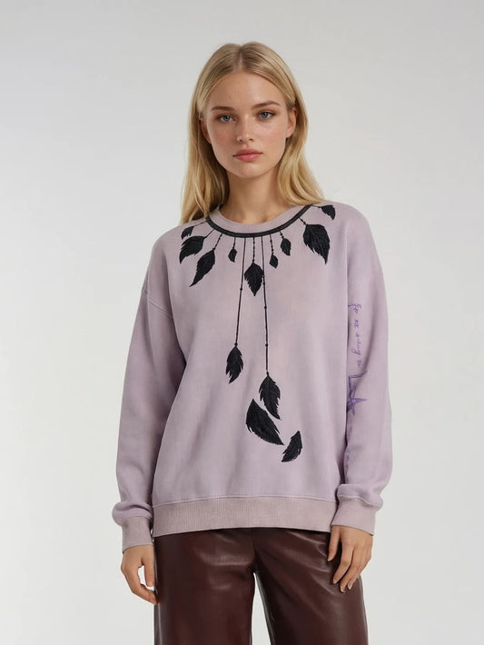 GEN Z girl wearing a light purple sweatshirt with black feather necklace design