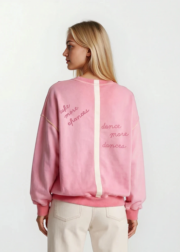 Back view of House of Malibu hand-painted pink sweatshirt with stripe detail and quote "Take More chances, Dance more dances"