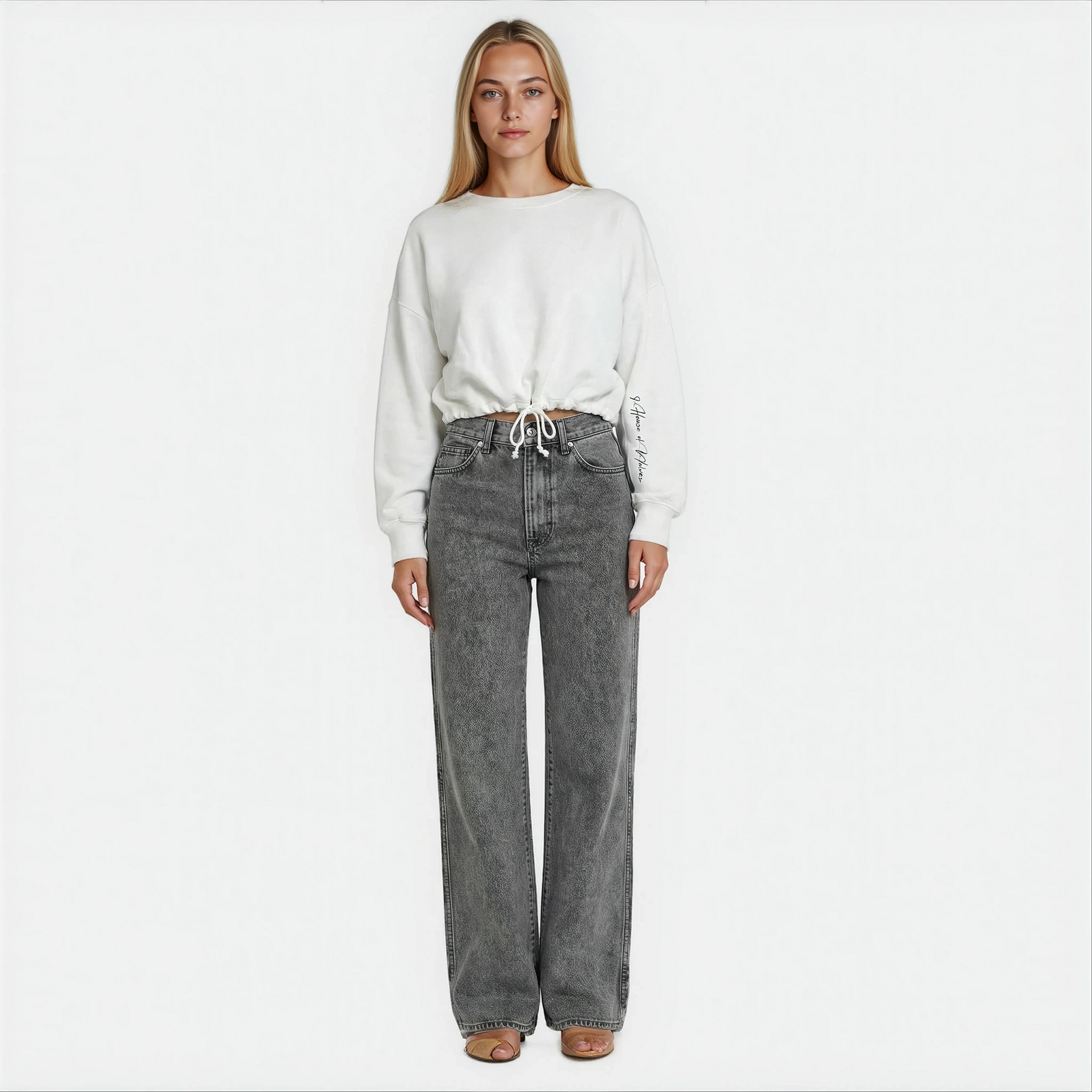 Front view of a women wearing white cropped House of Malibu sweatshirt with adjustable drawstring waist