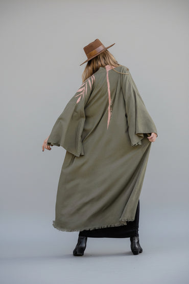 Back view of a model wearing a long hand-painted house of malibu kimono with spine stripe 