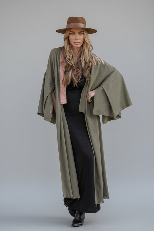 model wearing a long hand-painted house of malibu kimono with branch detailing shoulder design