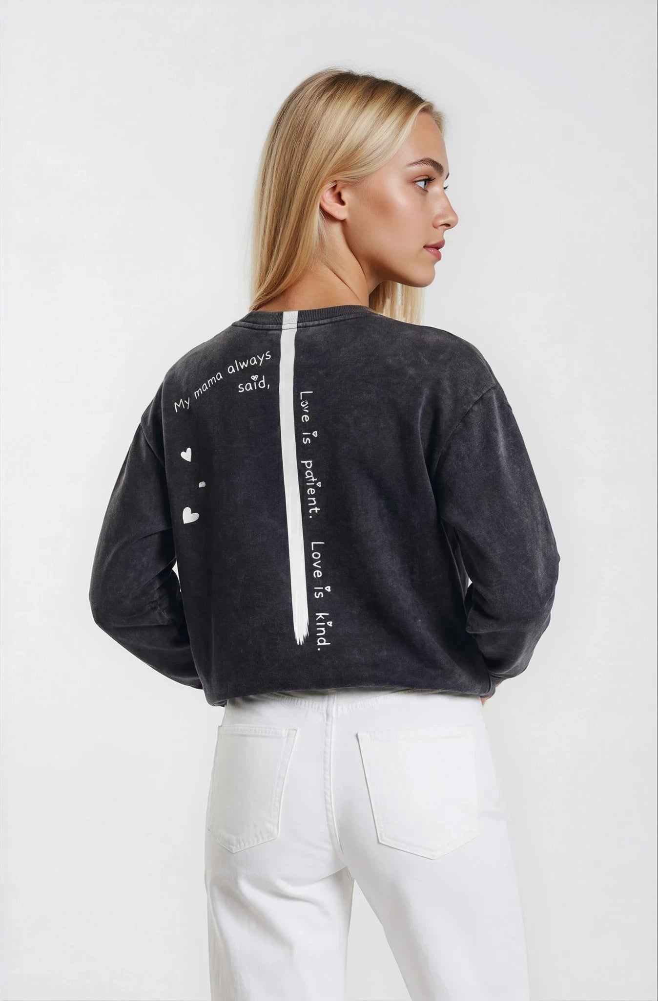 Woman wearing a  House-of-malibu Onyx sweatshirt with hand-painted quote and stripe down the back 