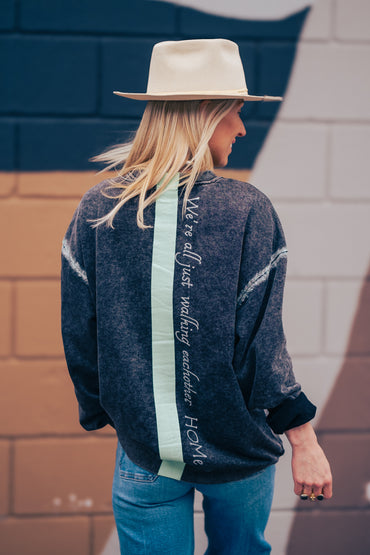 Women wearing a Onyx Washed Cotton Malibu Sweatshirt with hand painted quote on the back made by house of malibu