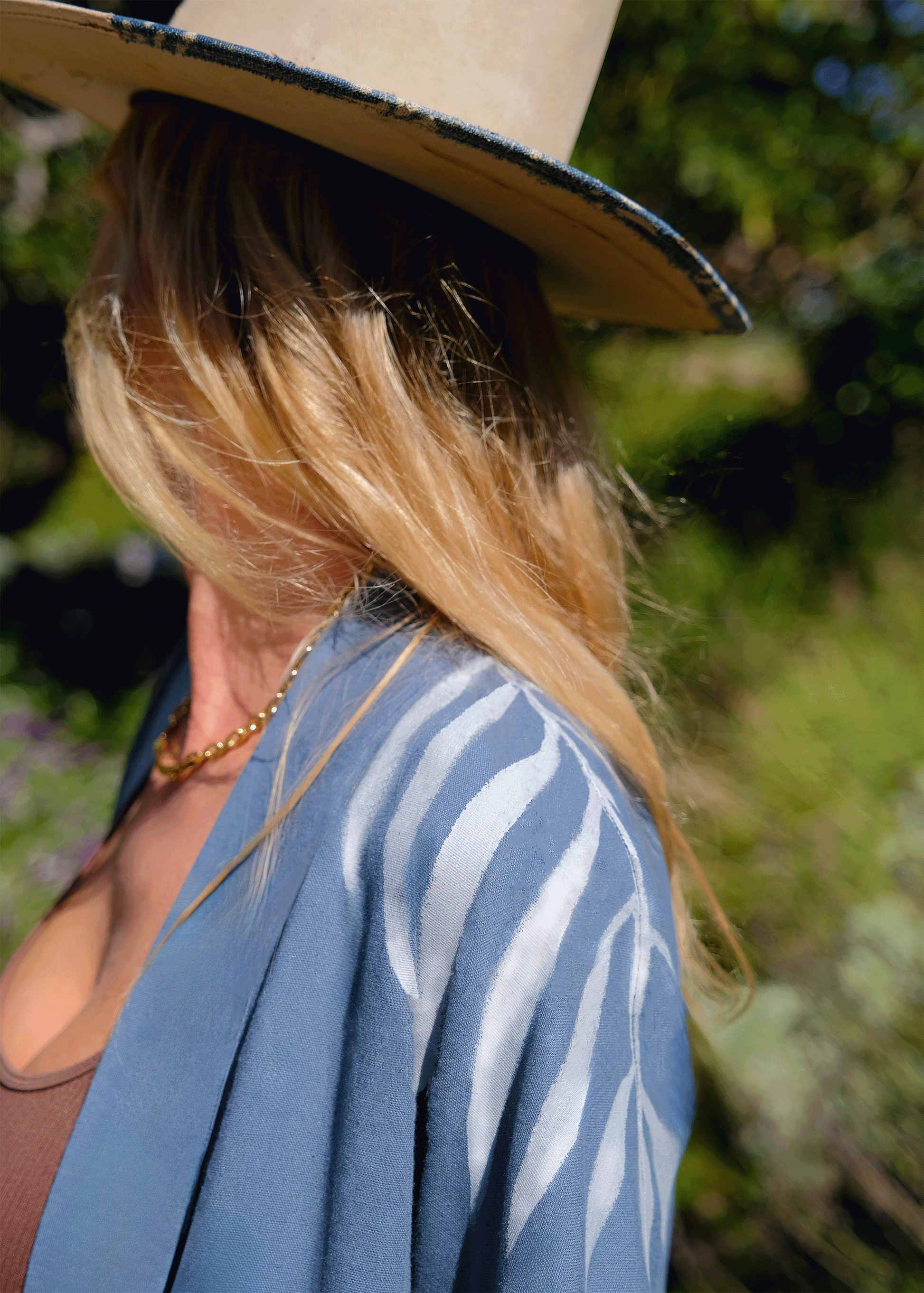 close up of house of malibu hand-painted shoulder details showing brush strokes
